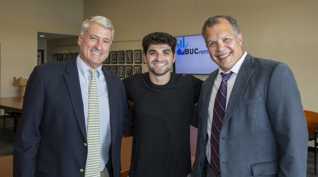 BPS_2479_FINAL Justin Rudolph '19, an alumnus of this private school, a proud graduate and inaugural BUC Ventures winner, smiling with Headmaster Joseph Seivold and Carlo DiNota
