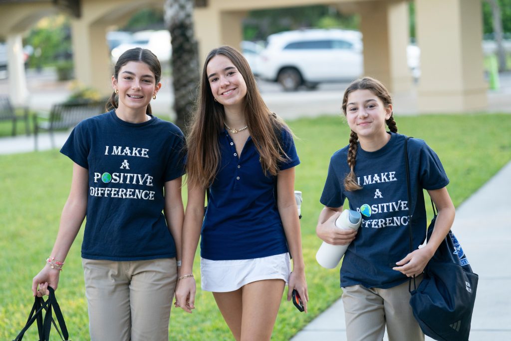 Kegley230921BPS147 Three private middle school girls walking on the quad on campus in Tampa on a gorgeous day