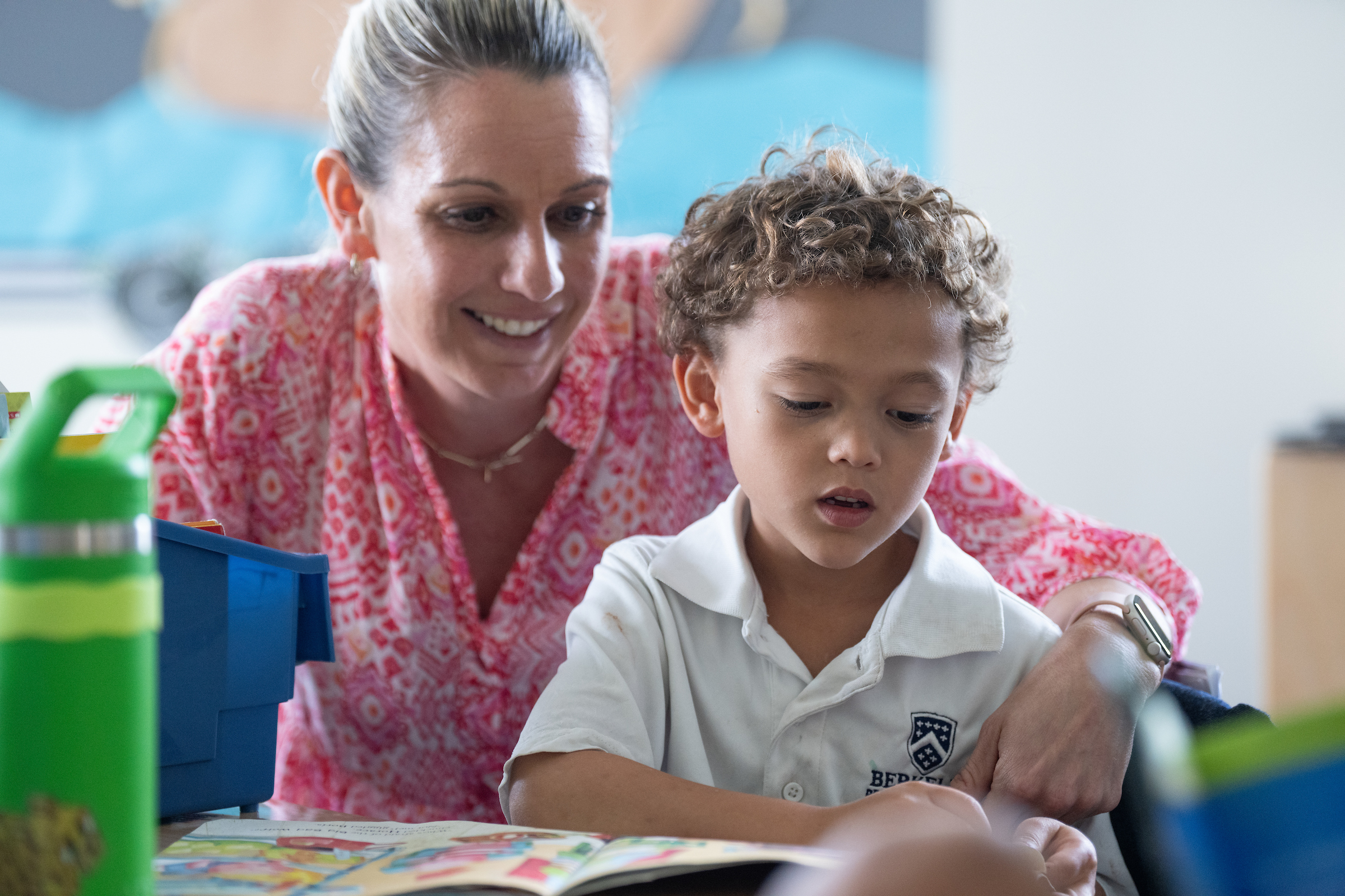 Photo of first grade teacher and student