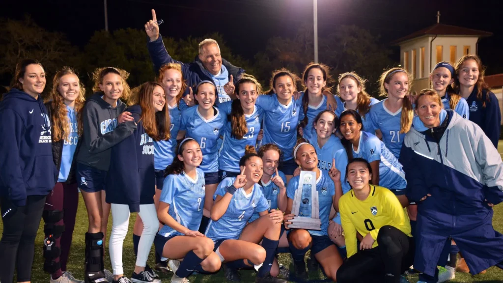 Photo of Ken Roberts and the 2019 Girls' Soccer Team