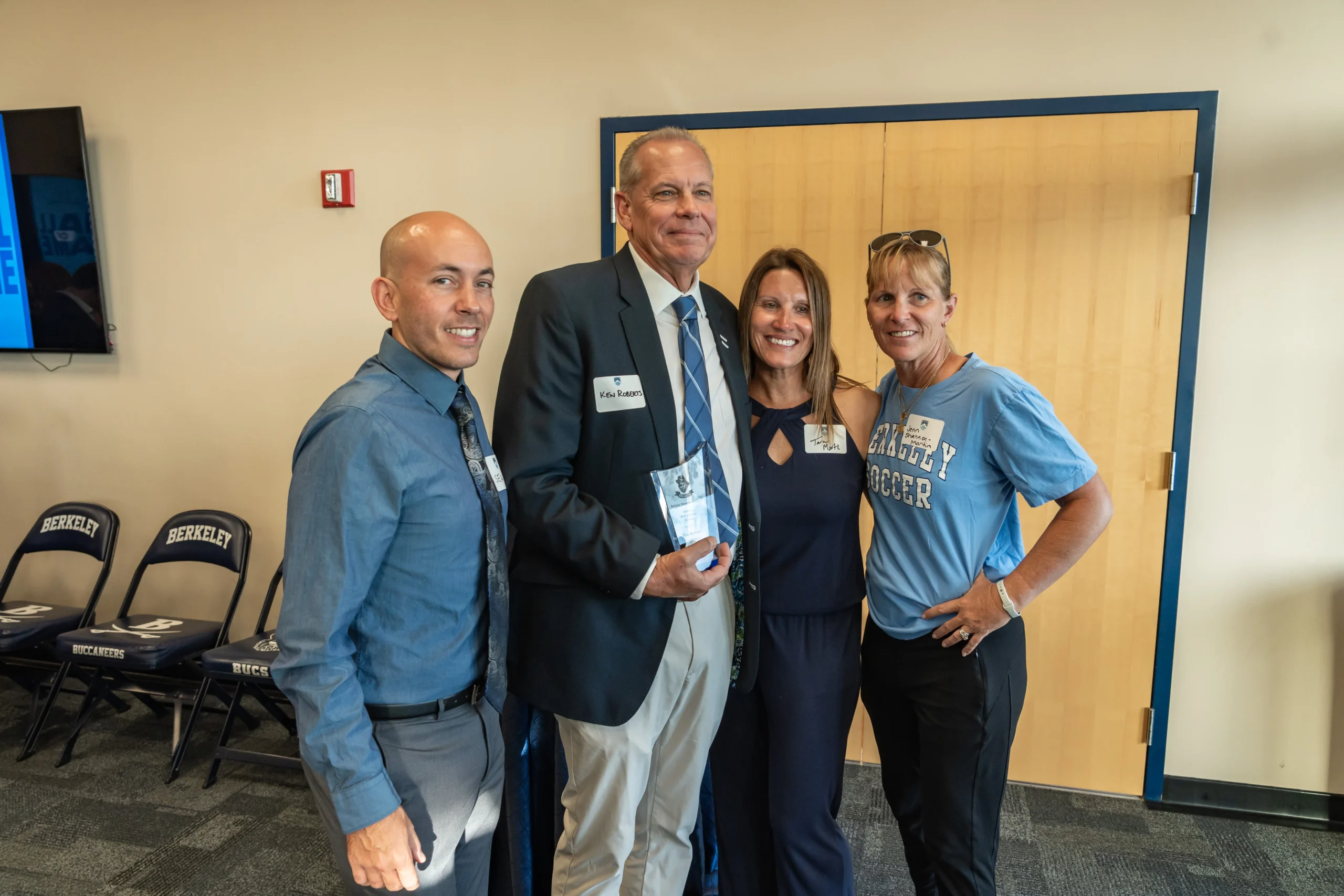 Photo of Ken Roberts and fellow teachers at Athletic Hall of Fame ceremony