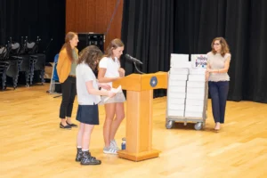 Students presenting the birthday boxes
