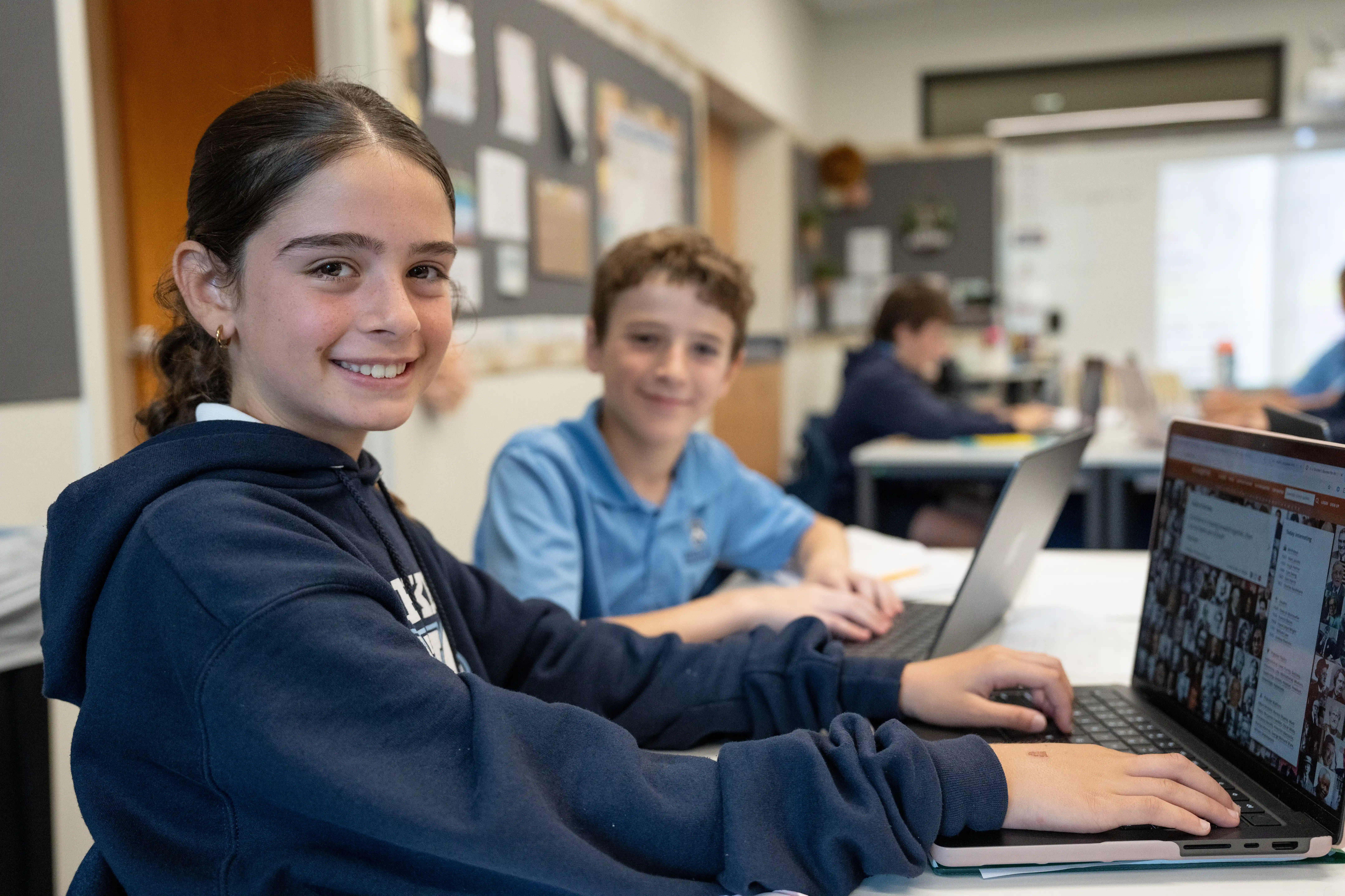 Image of two children using computers